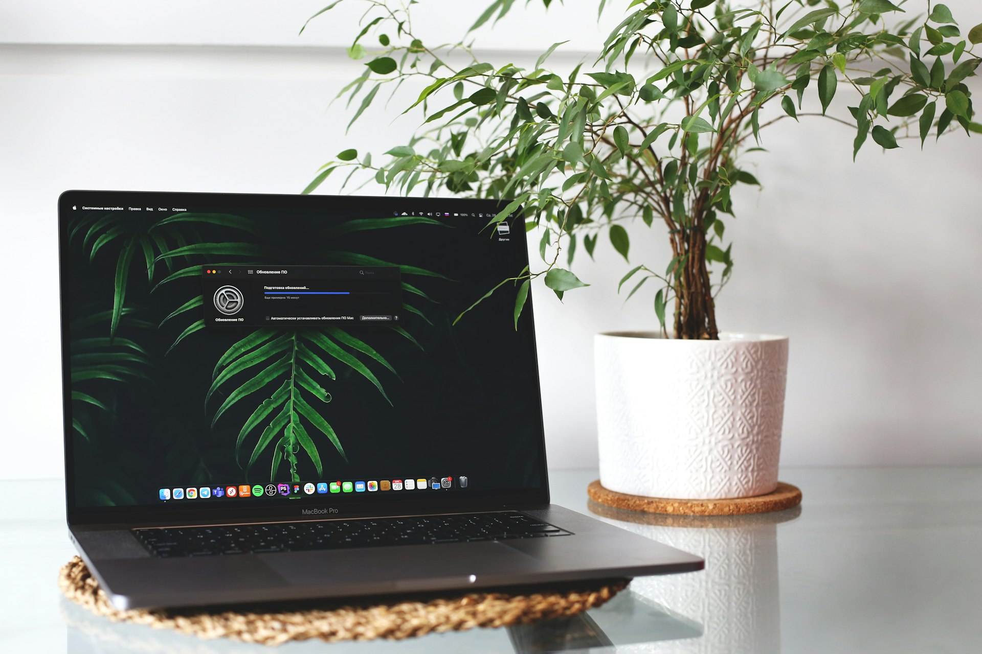 black laptop computer on brown wooden table